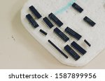 7400 Series IC chips plug on foam in laboratory