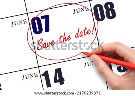 7th day of June. Hand drawing red line and writing the text Save the date on calendar date June 7.  Summer month, day of the year concept.