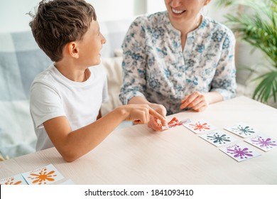 7-year-old Boy Plays A Memory Board Game With His Mother To Develop Memory And Attention At Home. The Child Plays With The Flash Cards, Fun To Spend Time With My Mother. Learning Colors And Language.