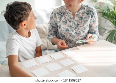 7-year-old Boy Plays A Memory Board Game With His Mother To Develop Memory And Attention At Home. The Child Plays With The Flash Cards, Fun To Spend Time With My Mother. Learning Colors And Language.