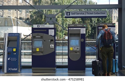 8 August 2016. Person Buying Train Ticket At The Machine. Unidentified People Buy Tickets From Vending Machine At Haymarket Railway Station In Edinburgh, Scotland