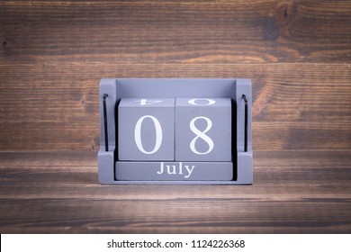8 July. Wooden, square calendar. business trip or holiday planning background - Shutterstock ID 1124226368