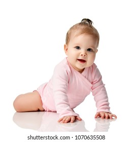 8 Month Infant Child Baby Girl Toddler Lying In Pink Shirt Learning To Crawl Isolated On A White Background