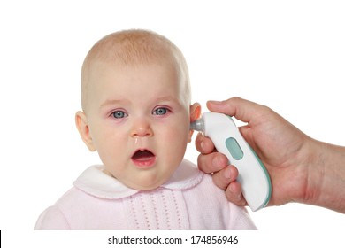8 Months Baby Girl Having Fever, Getting Temperature Check Up With An Ear Thermometer.