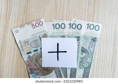 800 plus instead of 500 plus. Valorization of family 500+ program in Poland. Increasing Polish government assistance for children, social help in raising kids. Polish zloty banknotes composition. - Shutterstock ID 2321233983