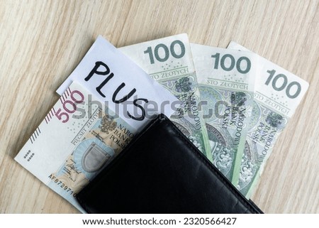 800 plus instead of 500 plus. Valorization of family 500+ program in Poland. Increasing Polish government assistance for children, social help in raising kids. Polish zloty banknotes composition.
