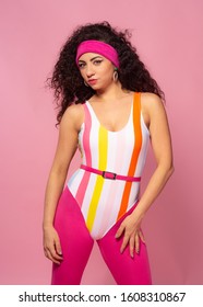 80's Fashion Woman Over Pink Background. Beautiful Athletic Girl In 80s Style Sportswear