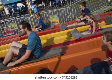 8-27-17 Syracuse, NY: Many People Ride Down A Big Slide At The Great New York State Fair. 