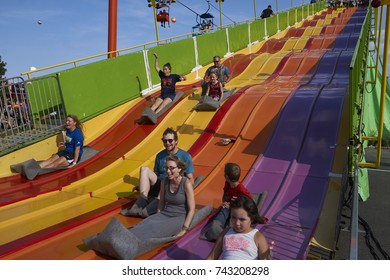 8-27-17 Syracuse, NY: Many People Ride Down A Big Slide At The Great New York State Fair. 