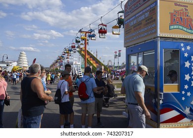 8-27-17 Syracuse, NY: People Stand In Line For Ride Tickets At The Great New York State Fair. 