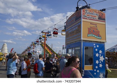 8-27-17 Syracuse, NY: People Stand In Line For Ride Tickets At The Great New York State Fair. 