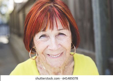 85 year old enjoying life with vibrant red hair