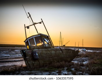 8th April 2017, Heswall Boat Yard, Wirral, UK. An Old Wrecked Fishing Boat Lies On The Banks Of The River Dee.