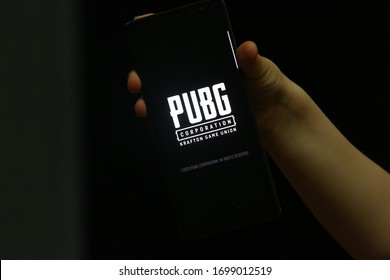 9 April 2020. Istanbul / Turkey. 
Child hands playing pubg on smart phone and pubg logo.