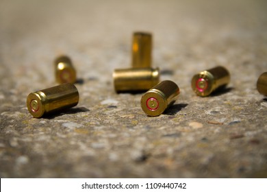 9 Mm Bullet Shells. It's Lying On The Ground