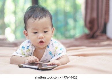 9 Months Asian Baby Playing Mobile Phone