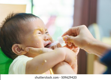 9 months old Asian baby refuses eating medicine after meal