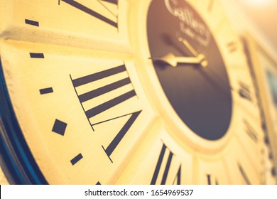9 o'clock clock,Close up of a clock face showing 15 minutes to 9 o'clock.