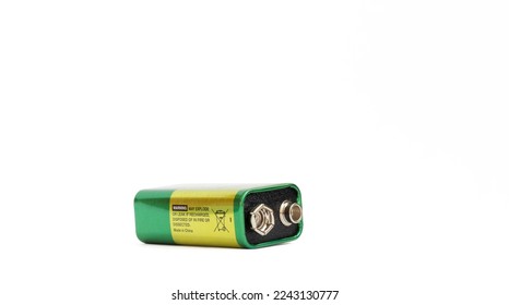 9 volt alkaline battery isolated on white background. 9 V (PP3) alkaline battery. Plus and minus poles resembling a pair of eyes. Copy space, space for text. No people, nobody. Metaphor. - Shutterstock ID 2243130777