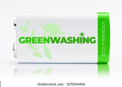 9 Volt Green And White Battery With The Word Greenwashing Printed On It. Greenwashing Is A Communication Technique Aimed At Building A False Image Of A Company In Terms Of Environmental Impact.