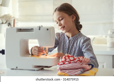 9 Years Old Child Studying Work With Sewing Machine