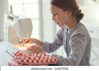 9 Years Old Child Studying Work With Sewing Machine