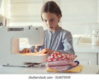 9 Years Old Child Studying Work With Sewing Machine