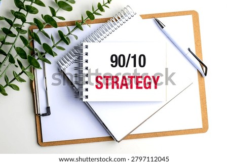 90 10 strategy concept with notebook, clipboard and office supplies on desk, representing productivity optimization, strategic planning,. 