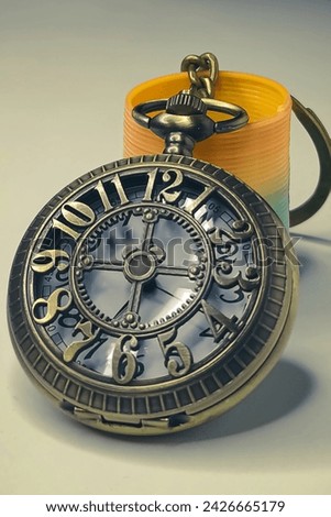 90's Antique pocket watch is made of bronze and has a visible gear mechanism.