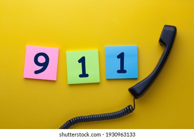 911 (emergency Telephone Number) Written On Note With Phone Handset