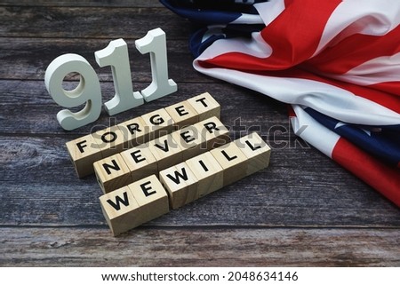 911 We will Never Forget Word alphabet letters on wooden background