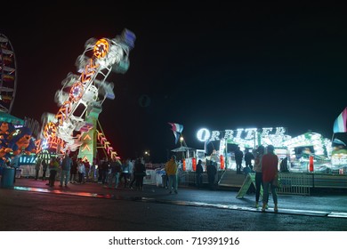 9-2-17 Syracuse Ny: People Wander Around The Midway At The Great New York State Fair At Night. 