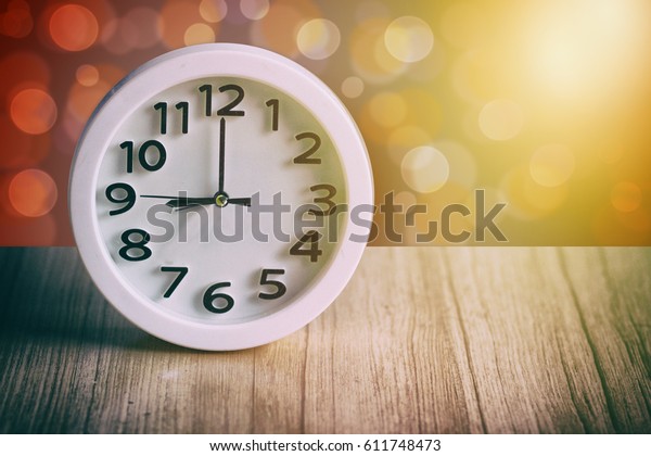 9am 9pm Clock On Wooden Table Stock Photo Edit Now