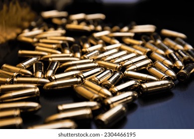 9mm ammunition spread out on black surface