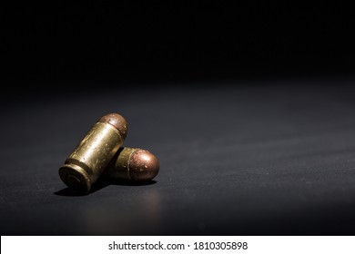 9mm bullet for pistol and self-defense on black background
