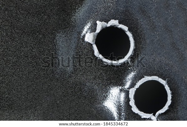 9mm exit bullet\
hole in a aluminum car door