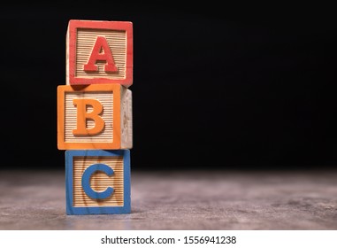 A, B and C wooden blocks - Shutterstock ID 1556941238