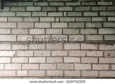 AAC blockwork wall texture showing precise alignment and smooth finish. Lightweight autoclaved aerated concrete blocks ideal for modern construction and architectural backgrounds.
