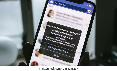 AACHEN, GERMANY - 05. January 2021 : Apple iPhone facebook app request permission from users to track their activity across other apps and websites for personalized