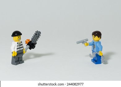 Aalter, Belgium, 10 september 2014, a policeman against a chainsaw murderer displayed in lego - Shutterstock ID 244082977