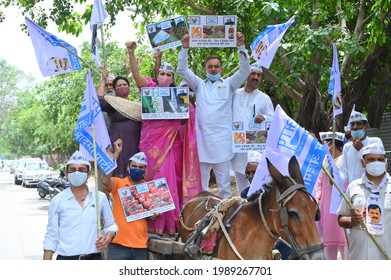 Aam Aadmi Party Workers Protesting Against Inflation By Placing A Scooter On A Tonga, Gurgaon, Haryana, India, 11 June 2021.