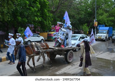 Aam Aadmi Party Workers Protesting Against Inflation By Placing A Scooter On A Tonga, Gurgaon, Haryana, India, 11 June 2021.