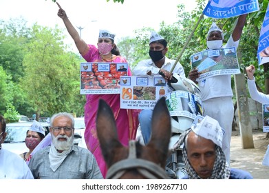 Aam Aadmi Party Workers Protesting Against Inflation By Placing A Scooter On A Tonga, Gurgaon, Haryana, India, 11 June 2021.