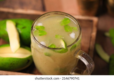 Aam ka panna refreshing summer cooler popular in northern and western parts of India ,summer cooler made from unripe green mangoes closeup with selective focus and blur