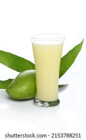 Aam Panna or Panha or Raw Mango juice  in a transparent glass with raw green mango 