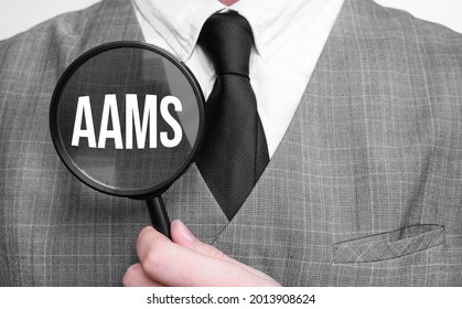 Aams Acronym Of Master Of Business Administration Degree. Education Concept. Businessman Hands With Magnifier.