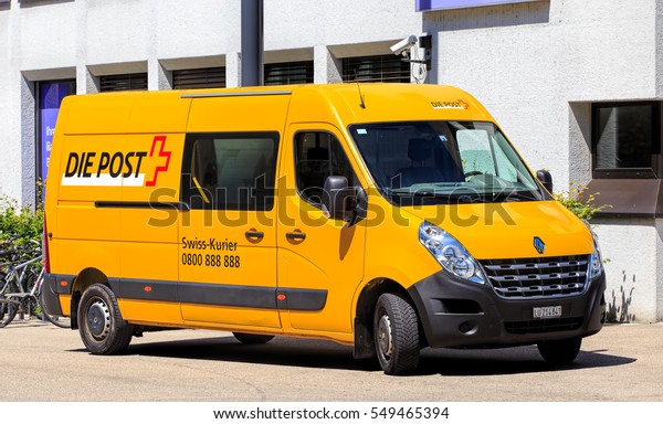 Aarau, Switzerland - 7 July, 2016: a van of\
the Swiss Post parked on Schlossplatz square. Swiss Post is the\
national postal service of\
Switzerland.