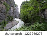 The Aare Gorge (German: Aareschlucht) is a section of the river Aare that carves through a limestone ridge near the town of Meiringen, in the Bernese Oberland region of Switzerland.