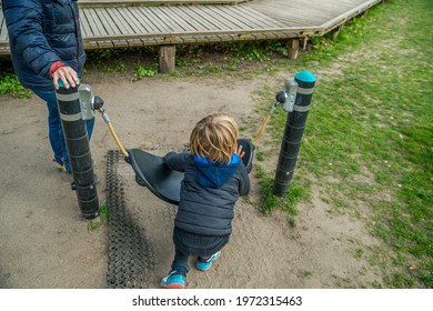 Aarhus Denmark, 1 May 2021 Children And Parents Play On The Park's Playground