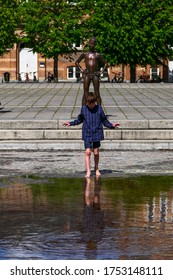 Aarhus, Denmark June 8, 2020 Children Playing In The Fountain In Thr City Hall Park